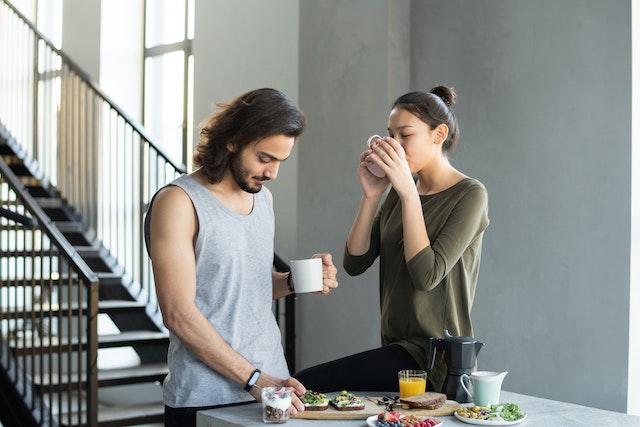 Couple eating a healthy breakfast as part of their morning routine.